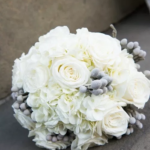 White Bridal bouquet of roses and hydrangea with silver brunia