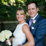 Wedding couple poses at the Wisteria Pergola Central Park