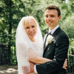 Bride and groom hug each other in Shakespeare Garden