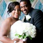 Bride and groom in front of colorful motif at Bethesda Fountain