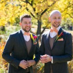 Two grooms smiling after getting married in Central Park