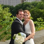 Newlyweds hug on Gapstow Bridge in Central Park