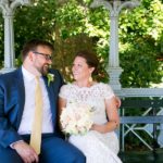 Bride and groom posing on bench at the Ladies Pavilion Central Park