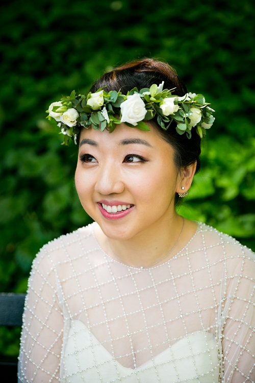 Petite bridal floral crown of white spray roses and greenery