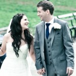 Newlyweds smile at each other while walking in Central Park