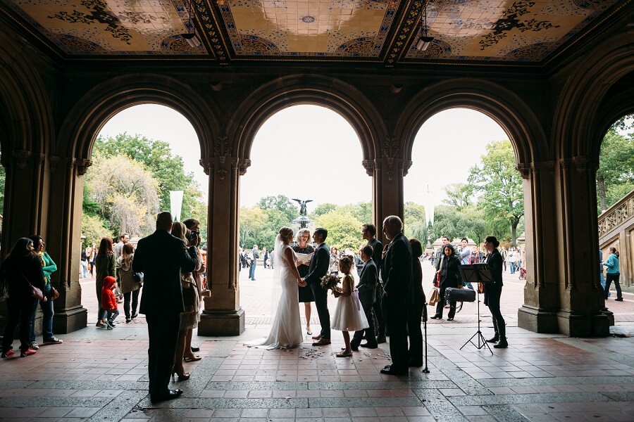Intimate wedding ceremony under the arches at Bethesda Fountain