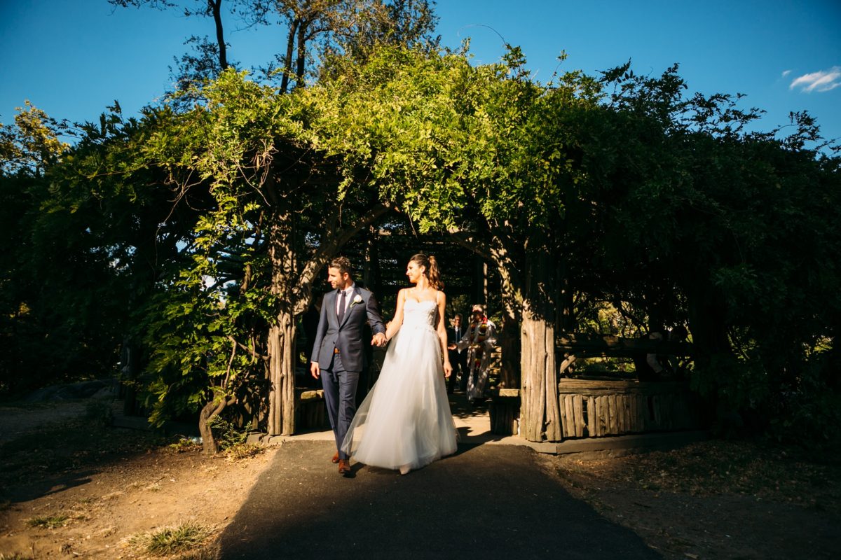 NYC outdoor wedding venues & locations: Newlyweds exiting Cop Cot during golden hour