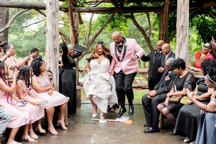 Newlyweds jump the broom at Cop Cot in Central Park