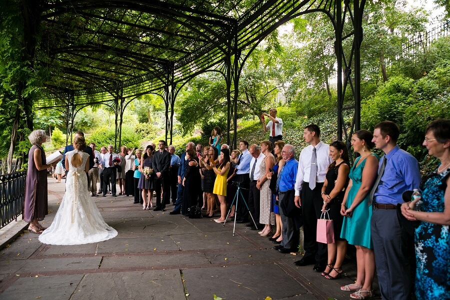 Large wedding ceremony at Wisteria Pergola in Conservatory Garden