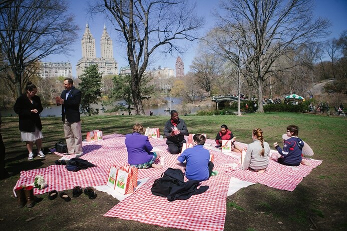 Group enjoys a picnic on Cherry Hill in Central Park