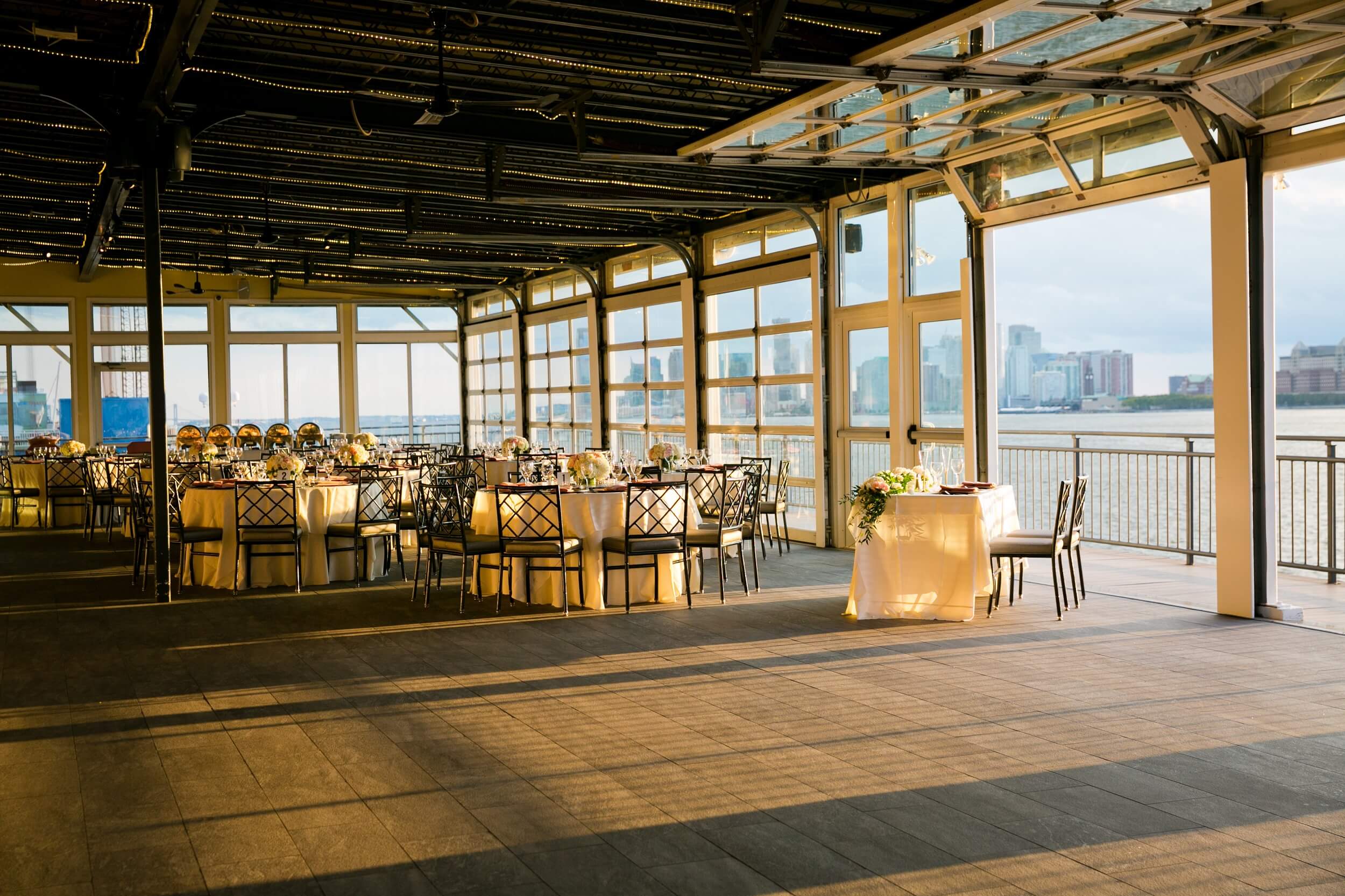 Tables at a wedding reception at Sunset Terrace during golden hour