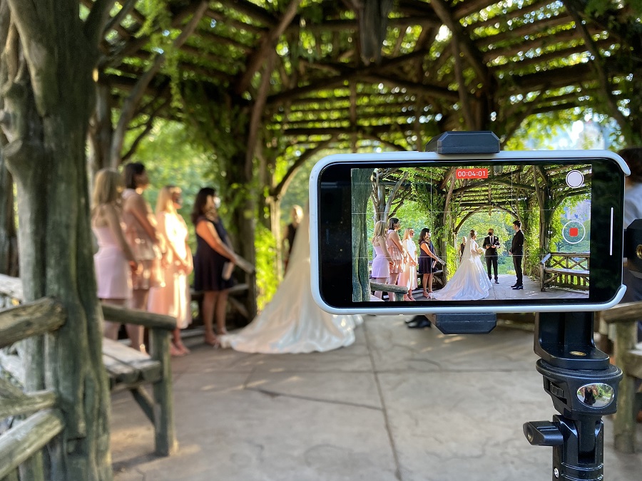 Closeup of phone showing videorecording of microwedding
