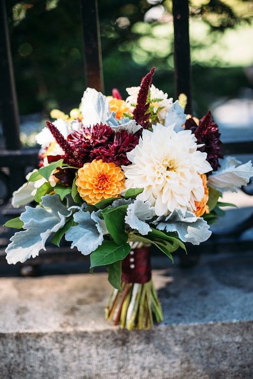 Fall bridal bouquet with burgundy dahlias