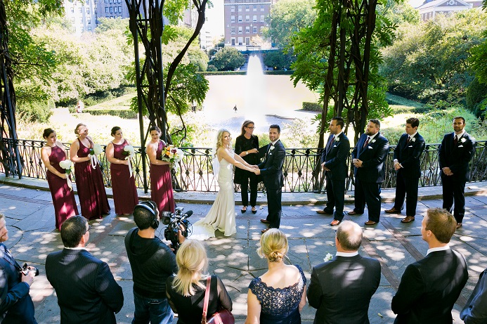 Couple getting married under the Wisteria Pergola in Central Park