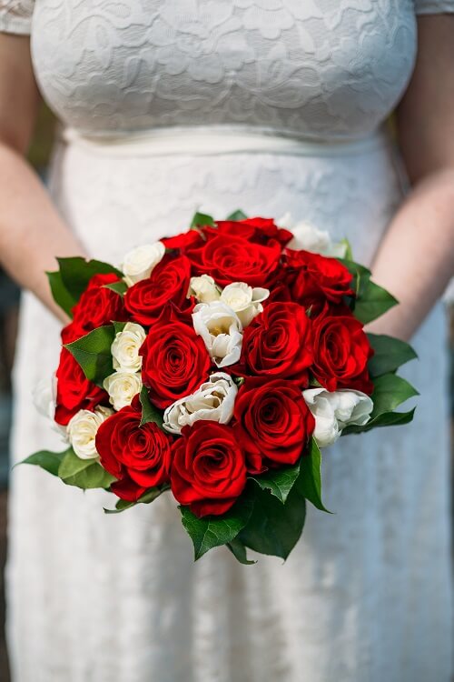 Red rose bridal bouquet with white accents and greenery