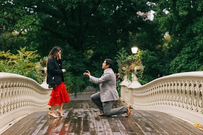 Surprise proposal on Bow Bridge in Central Park